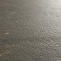 A coarse, textured surface resembling asphalt, characterized by a mix of subtle grey a Royalty Free Stock Photo