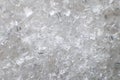 Coarse White Iodized Salt. Detailed Background Texture Macro Close-up. Salt Crystals Of Different Sizes