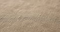 Coarse woven burlap fabric in natural brown. The texture is rustic, with a grid-like patte Royalty Free Stock Photo