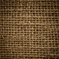Coarse woven fabric with a rustic texture, featuring interlacing brown fibers typically Royalty Free Stock Photo