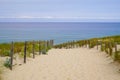 Coast access sandy sea patway fence to ocean beach atlantic coast at Cap-Ferret in France Royalty Free Stock Photo