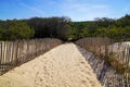 Coast access wooden fence to ocean beach atlantic coast at Lacanau in France Royalty Free Stock Photo