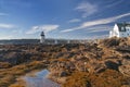 The coast of the Atlantic Ocean with a lighthouse. Marshall Point Light. USA. Maine. Royalty Free Stock Photo