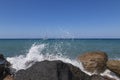 Coast and beach of Vlychada on Santorini island in Greece. In the background blue sky and waves at sea Royalty Free Stock Photo