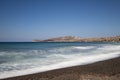 Coast and beach of Vlychada on Santorini island in Greece. In the background blue sky and waves at sea Royalty Free Stock Photo