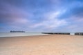 Coast of Breskens during sunrise, With a Cargoship in the background Royalty Free Stock Photo