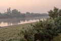 Coast of calm flat river at dawn Royalty Free Stock Photo