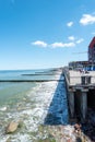 The coast of the city of Zelenogradsk with a view of the embankment, houses and pier, top view