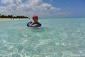 The coast of Cuba, Varadero, a Cuban boy swims in the azure waters of the Atlantic Ocean.