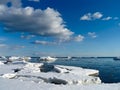 Spring.The coast of the Finnish Gulf. Snow-covered shore and bay freed from ice.