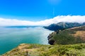 Coast at Golden Gate Bridge in clouds on a beautiful summer day - Panoramic view from Battery Spencer - San Fancisco Bay Area,