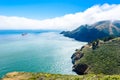 Coast at Golden Gate Bridge in clouds on a beautiful summer day - Panoramic view from Battery Spencer - San Fancisco Bay Area,