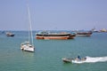 Coast Guard boat goes by luxury sailing boat, fishing and cargo ships