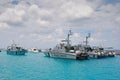 Coast Guard Vessel Cutter Ship & luxury leisure cruise yacht with turquoise blue water at Male, Maldives Royalty Free Stock Photo