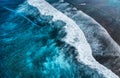 Coast with high waves as a background from top view. Blue water background from top view. Summer seascape from air. Indonesia.