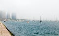Coast of Lake Michigan in the fog with parked boats. Royalty Free Stock Photo