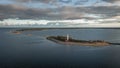 Coast and lighthouse Lange Erik in the north of the island of Ãland in the east of Sweden from above during sunset