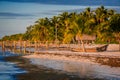 Coast line of Key West with wooden boat pulled up onto the sand Royalty Free Stock Photo