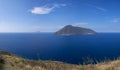 Coast of Lipari with cactus and view to volcano island Salina, Sicily Italy