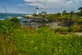 Coast of the ocean with a view of the lighthouse. Maine`s famous lighthouse. USA. Maine. Royalty Free Stock Photo