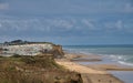 From the coast path, the beaches of the North Norfolk coastline near Cromer. A large caravan holiday park appears on the left.