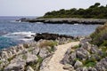 Coast pathway stones on bright summer day view mediterranean sea in south Antibes Juan-les-Pins France southeast Royalty Free Stock Photo