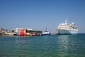 The marina in Kusadasi. The coast and port in the city, fishing boats and tourist ship. Place of holiday photos