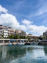 Tivat, Montenegro - 11 august 2023: Coast of the town of Porto with colorful villas, expensive boutiques and marina