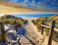 Coast wooden fence access sandy pathway beach Royalty Free Stock Photo