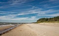 Coastal area in Lithuania Coastal scenery with sandy beach, dunes with marram grass and rough sea on a clear summer day