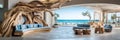 Coastal beachfront hotel lobby with coastal decor, driftwood accents, and panoramic ocean views