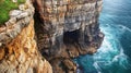 Coastal Cave and Rocky Cliffs Overlooking Ocean Waves Royalty Free Stock Photo