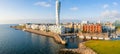 A coastal city in Sweden with the Turning Torso building in the middle of the photo