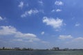 A coastal city under the blue sky; beautiful clouds in the vast sky Royalty Free Stock Photo