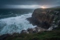 coastal cliff with view of stormy sea and lightning strikes Royalty Free Stock Photo