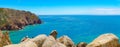 Coastal cliffs in the Atlantic Ocean at Cape Roca in Portugal. Panoramic landscape of Portuguese coast. Picturesque seascape Royalty Free Stock Photo