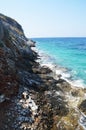 Coastal cliffs and blue waters Royalty Free Stock Photo