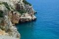 Coastal cliffs of limestone. The coast of Mediterranean Sea in Turkey Royalty Free Stock Photo