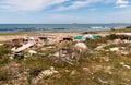 Coastal degradation with dirty beach, rubbish and domestic waste polluting the Capaci beach in province of Palermo. Royalty Free Stock Photo