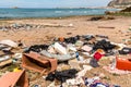 Coastal degradation with dirty beach, rubbish and domestic waste polluting the Capaci beach in province of Palermo. Royalty Free Stock Photo