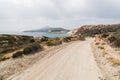Coastal dirt road along Aegean sea on Milos island, Greece