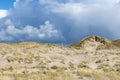 Coastal dune with small hills, wild grass on Camperduin beach Royalty Free Stock Photo