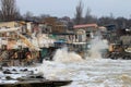 Coastal erosion - houses built on weak clay soil slide down to the sea Royalty Free Stock Photo