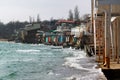 Coastal erosion - houses built on weak clay soil slide down to sea Royalty Free Stock Photo