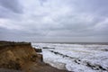 Coastal errosion taking place duirng a winter storm. Many homes have recently been lost in this community due to coastal errosion Royalty Free Stock Photo