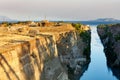 Coastal fortifications of the Corinth Canal in Greece in the bright rays of the morning rising sun