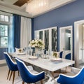 17 A coastal-inspired dining room with a white wooden table, blue upholstered chairs, and a chandelier made of shells1, Generati Royalty Free Stock Photo