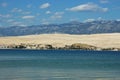 Coastal Landscape with Blue Mountains and Small Village Royalty Free Stock Photo