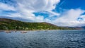 Coastal landscape with fishing and pleasure boats docked near the coast in Ullapool, Scotland. Royalty Free Stock Photo