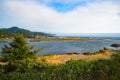 Coastal landscape of Gold Beach, Oregon, with Rogue River and mountains Royalty Free Stock Photo